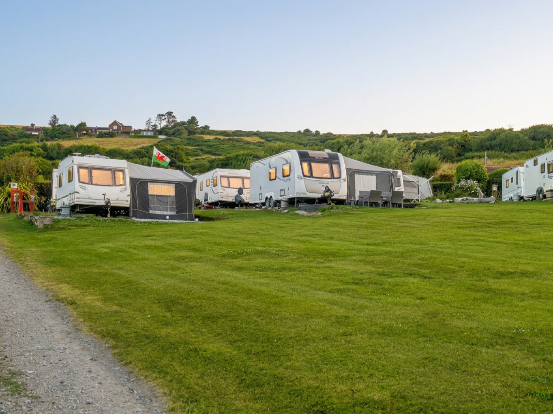 Seasonal touring caravans with open grass and countryside at Crackwell Holiday Park